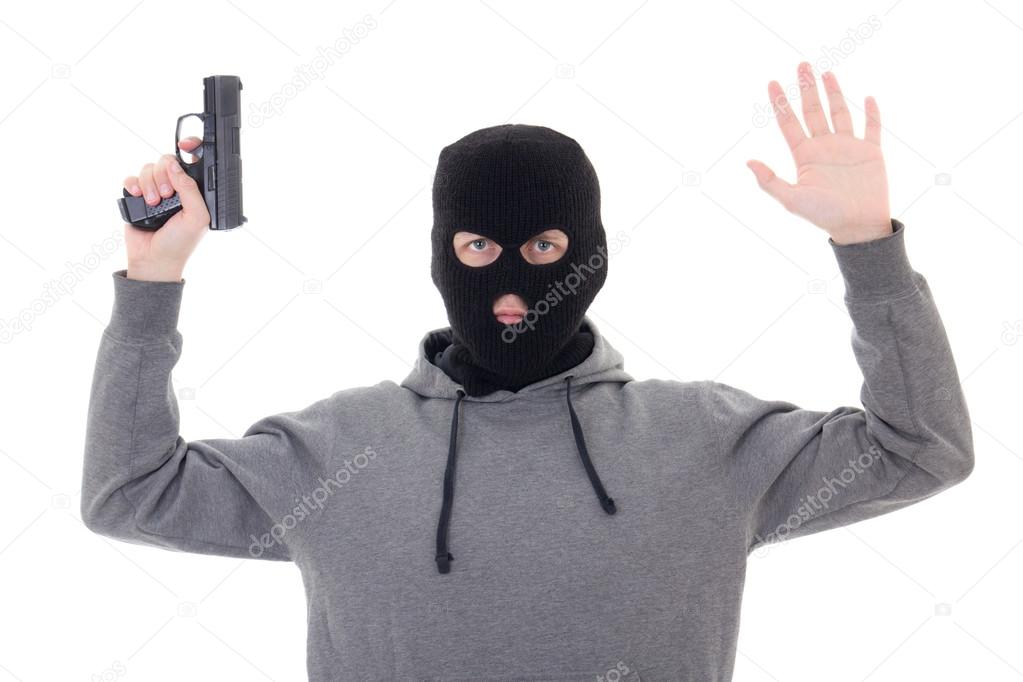 man in black mask with gun holding hands up isolated on white