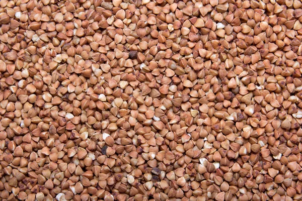 Texture background - close up of raw buckwheat — Stock Photo, Image