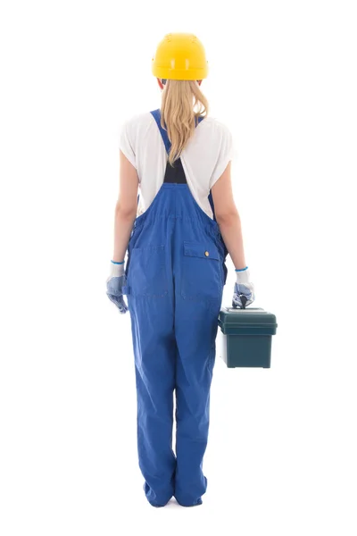 Вид ззаду жінки в синій формі будівельника з коробкою інструментів ізольовані — стокове фото