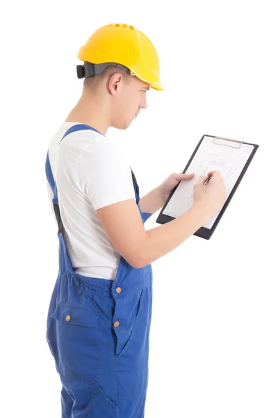 Man builder in blue uniform writing something on blueprint isola – stockfoto