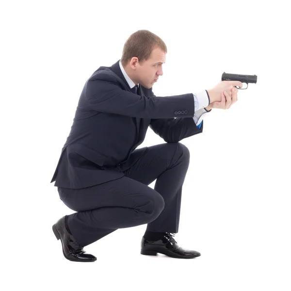 Special agent man in business suit sitting and shooting with gun — Stock Photo, Image