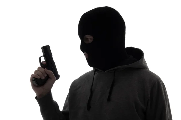 Silhouette de l'homme criminelle en masque tient fusil isolé sur blanc — Photo