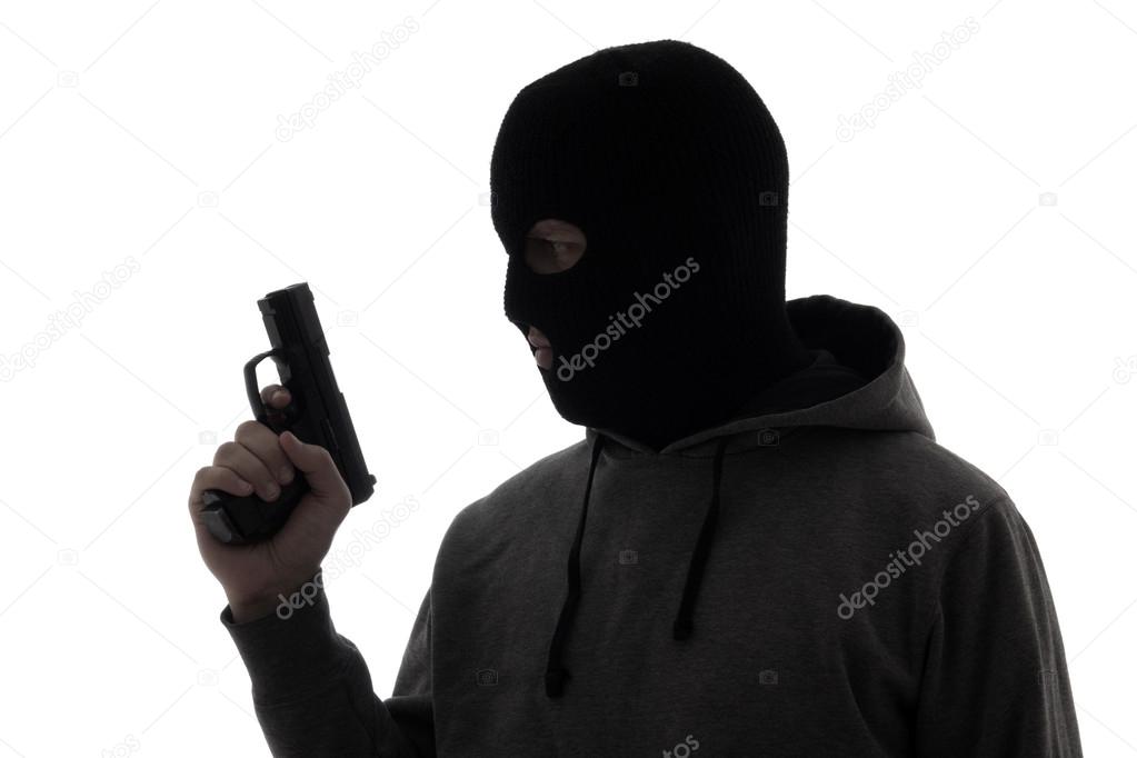 silhouette of criminal man in mask holding gun isolated on white
