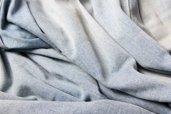 Texture background - wrinkled blue jeans material — Stok Foto