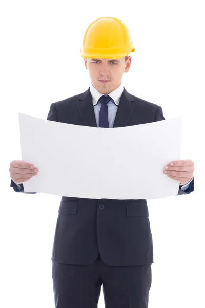 Hombre de negocios guapo en casco de constructor amarillo con blueprint —  Fotos de Stock