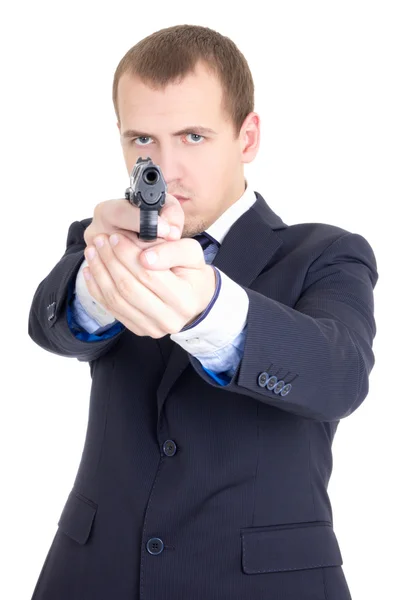 Серьёзный человек в деловом костюме, целью пистолет, изолированные на белом фоне — стоковое фото