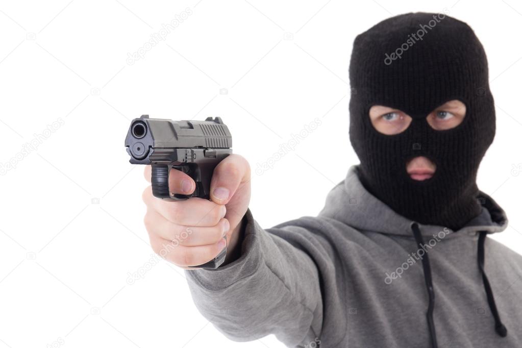 Man in mask aiming with gun isolated on white