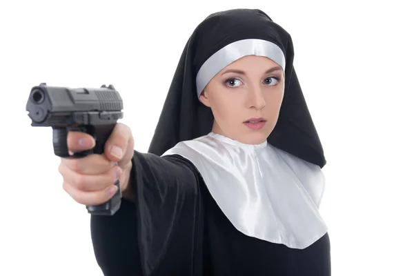 Young woman nun shooting with gun isolated on white — Stock Photo, Image