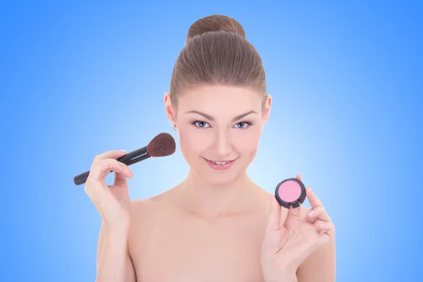 Portrait of young beautiful woman with make up brush and rouge o — Stock Photo, Image