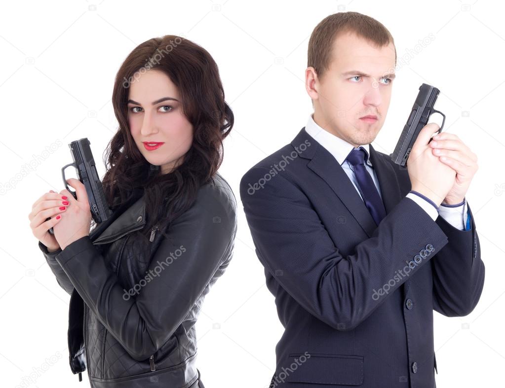 young man in business suit and elegant woman with guns isolated 