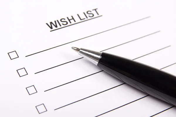 White paper with blank wish list and pen — Stock Photo, Image