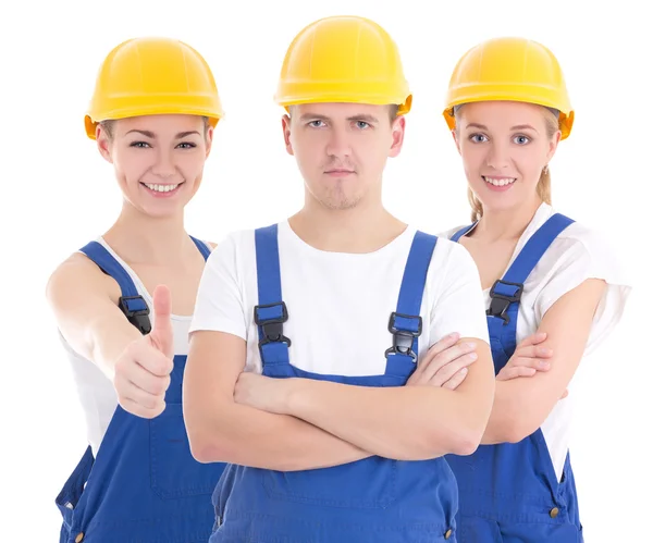 Dos jóvenes mujeres y hombre de uniforme azul constructor aislado en w —  Fotos de Stock