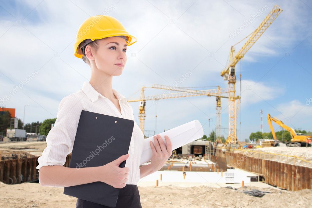 business woman architect in yellow builder helmet 