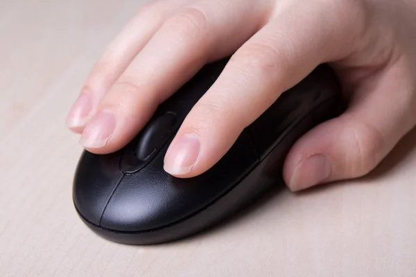 Close up of wireless mouse in hand on table — Stock Photo, Image