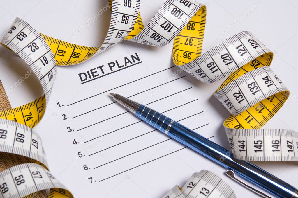 sheet of paper with diet plan, pen and measure tape