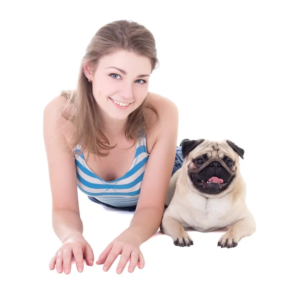 Young beautiful woman lying with pug dog isolated on white — Stock Photo, Image