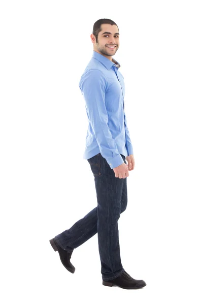 Side view of young arabic bearded business man in blue shirt wal - Stock-foto
