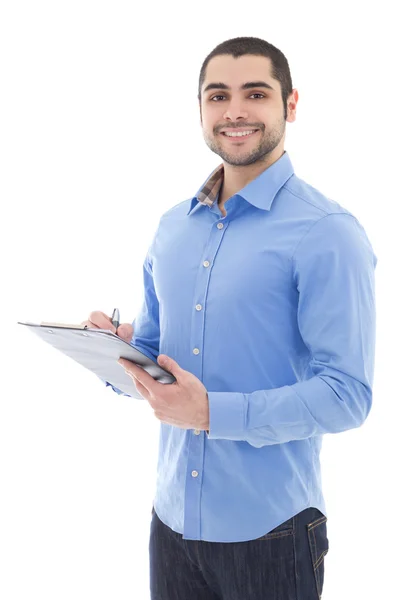 Young arabic man writing something on clipboard isolated on whit — Stock Photo, Image