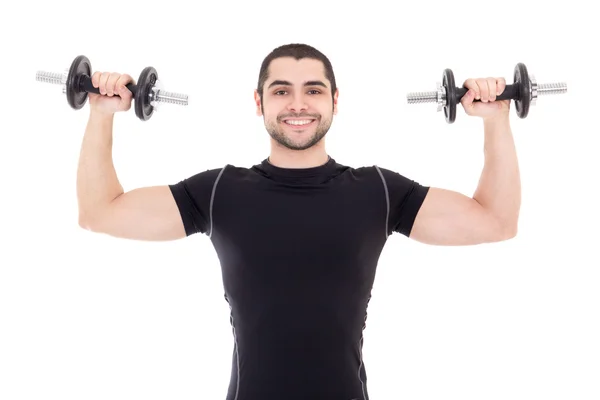 Young strong man in black sportswear doing exercises with dumbbe — Stock Photo, Image
