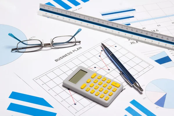 Business objects - graphs, charts, pen and calculator — Stock Photo, Image