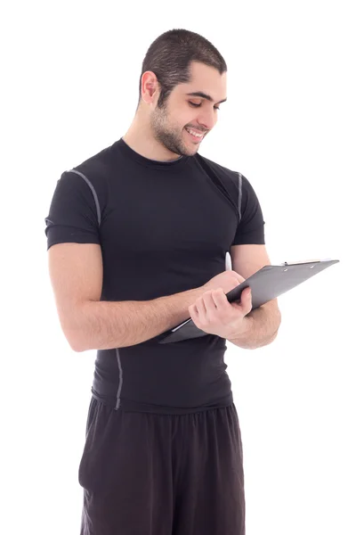 Porträt von gut aussehend Fitnesstrainerin in Sportbekleidung mit clipboar — Stockfoto