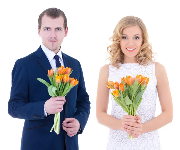 Holiday concept - young man and woman with tulips in hands isola — Stock Photo, Image