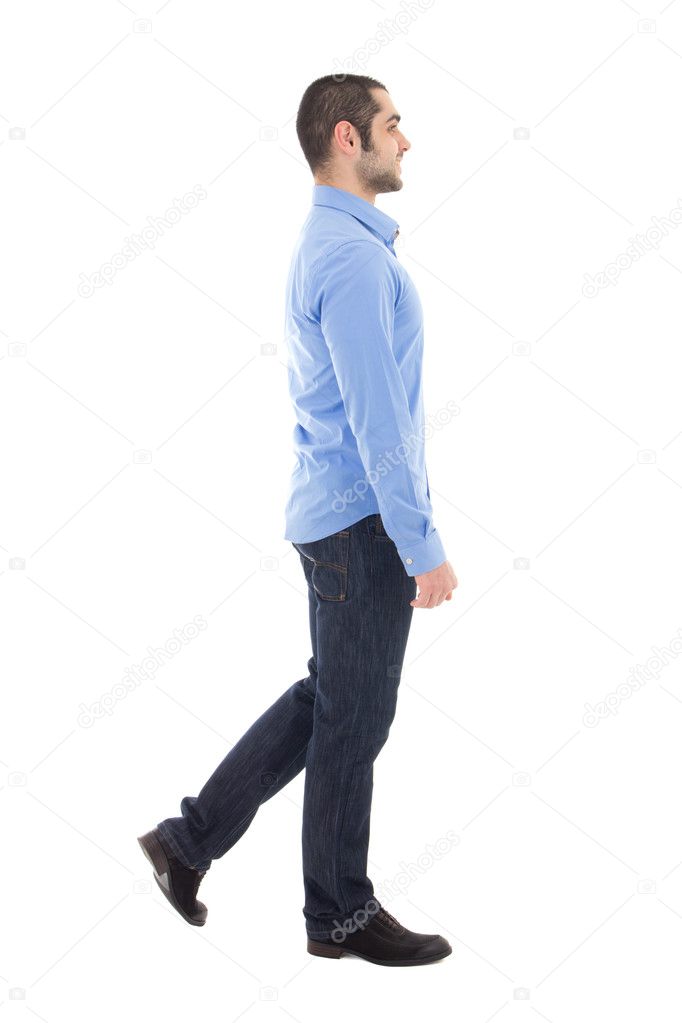 side view of young arabic business man in blue shirt walking iso