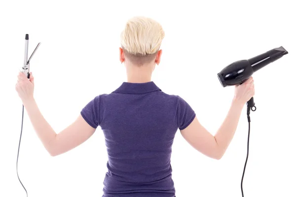 Back view of young woman hair stylist posing with hairdryer and — Stock Photo, Image