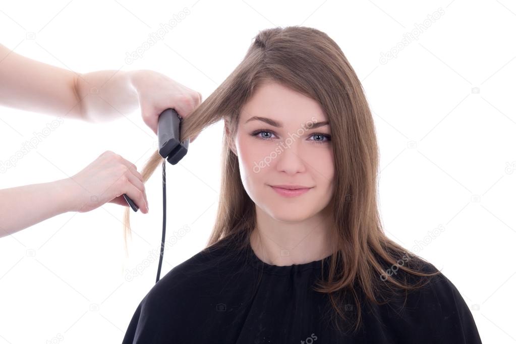 hair stylist doing haircut to beautiful woman isolated on white