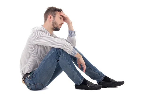 Depression concept - stressed man sitting isolated on white — Stock Photo, Image