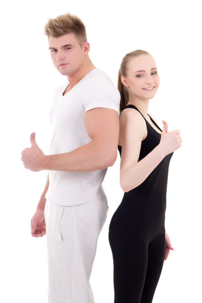 Retrato de hombre joven y mujer en ropa deportiva pulgares arriba aisladas —  Fotos de Stock
