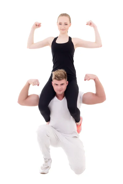 Young slim woman sitting on shoulders of her muscular boyfriend — Stock Photo, Image