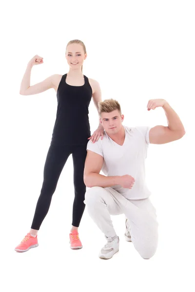 Young muscular man and beautiful slim woman in sportswear showin — Stock Photo, Image