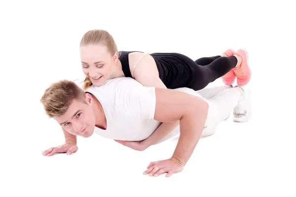 Training en liefde concept - jonge gespierde man doet push ups wit — Stockfoto