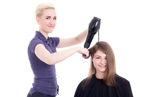 Щаслива жінка перукар робить зачіску для клієнта ізольовано на білому — стокове фото