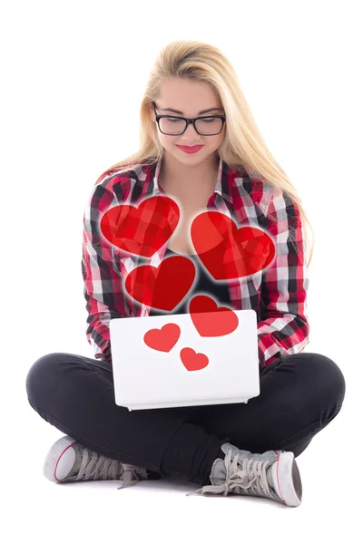 Love concept - young blondie woman sitting with laptop isolated — Stock Photo, Image