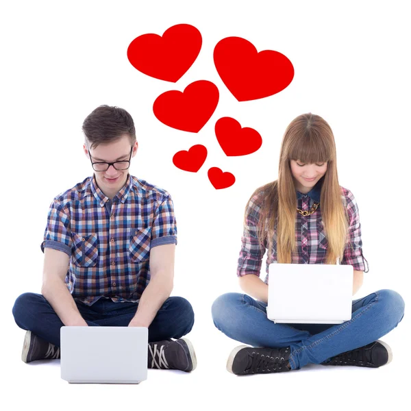 Virtual love concept - teenage boy and girl sitting with compute — Stock Photo, Image