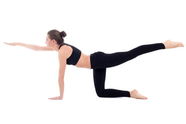 Jonge mooie sportieve vrouw doen stretching oefening geïsoleerd — Stockfoto