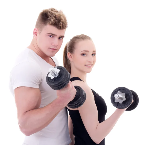 Portrait of man and woman in sportswear doing exercises with dum Stock Picture