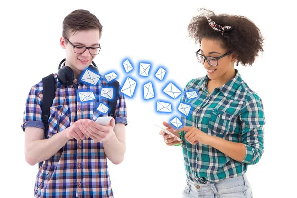 Teenage boy and girl sending sms messages each other isolated on — Stock Photo, Image