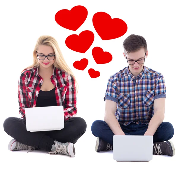 Online dating concept - young man and woman sitting with laptops — Stock Photo, Image