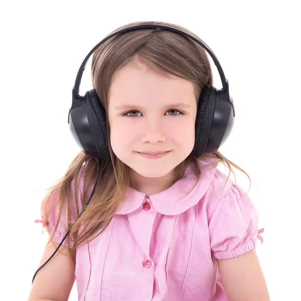 Cute little girl listening music in earphones isolated on white — Zdjęcie stockowe