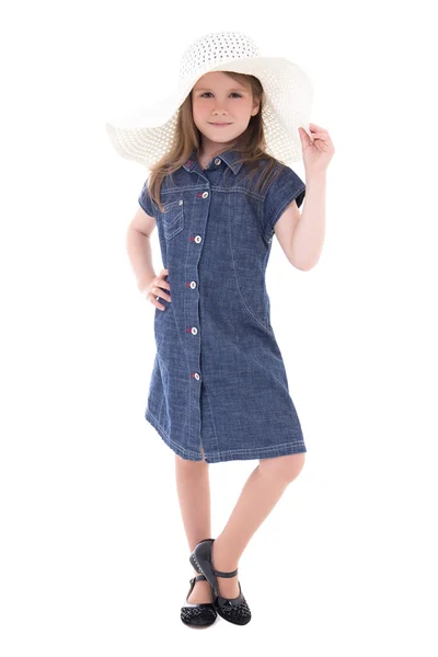 Cute little girl in denim dress and big summer hat isolated on w — Fotografia de Stock