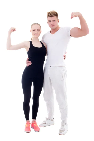 Young man and woman in sportswear showing muscles isolated on wh — Stock Photo, Image