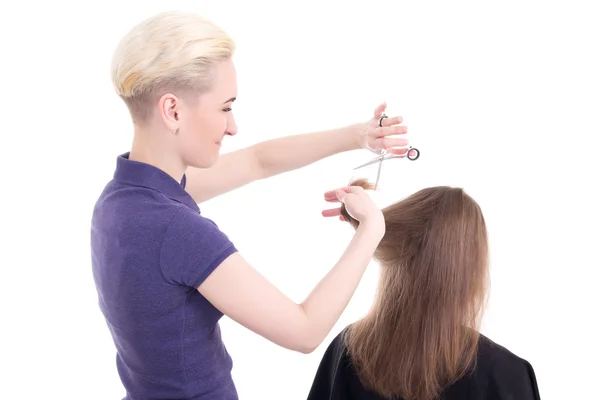 Vrouw Haarstylist kapsel doen naar client geïsoleerd op wit — Stockfoto