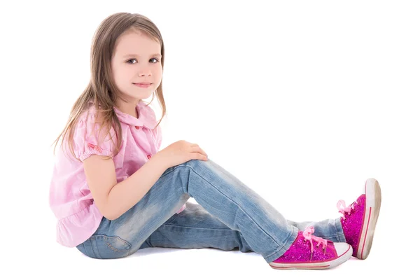 Cute little girl sitting isolated on white — Stock Photo, Image