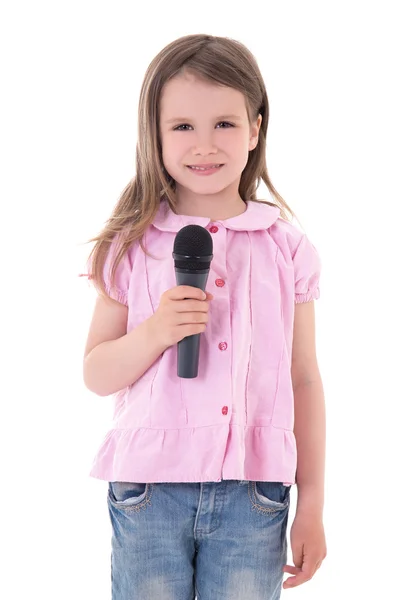 Музыкальная концепция - милая маленькая девочка с микрофоном, изолированные на whi — стоковое фото