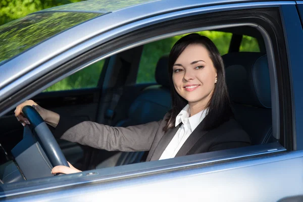 Young business woman driving her car — Stock Photo, Image