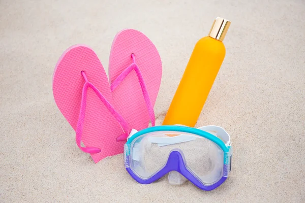 Summer concept - diving mask, slippers and suntan lotion bottle — Stock Photo, Image