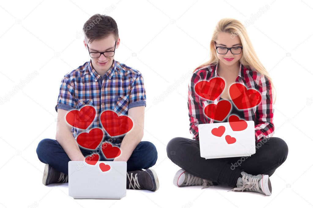online dating concept - young man and woman sitting with laptops